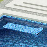 Beach Glass pool float drifting in pool with a matching luxury liner.