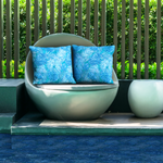 Poolside seating featuring Palm Springs pillow covers.