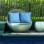 Poolside seating featuring Oceania pillow covers.