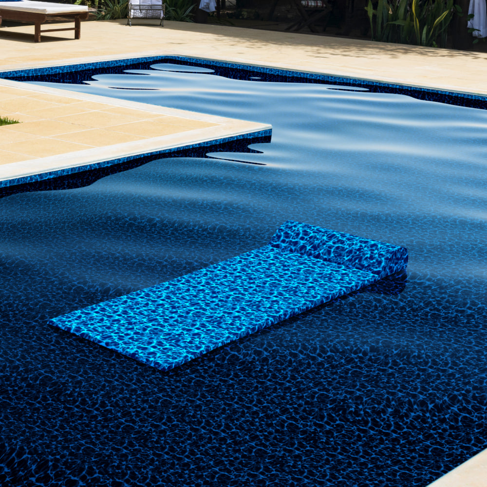 
                  
                    Load image into Gallery viewer, Beautiful Indigo Seas pool float in pool with a matching luxury liner.
                  
                