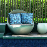 Poolside seating featuring Camino Lagoon pillow covers.