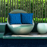 Poolside seating featuring Indigo Seas pillow covers.